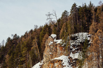 Sun among the mountain peaks. Beautiful winter landscape,the harsh, cold winter Altai, Severe...