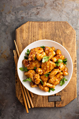 Spicy sweet and sour chicken with rice and cabbage