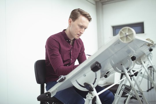 Architect working at drafting table