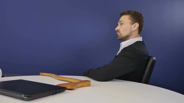 Angry boss with wooden ax finish the conversation on webcam