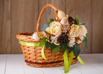 Fototapeta na wymiar beautiful basket is decorated with a flower arrangement