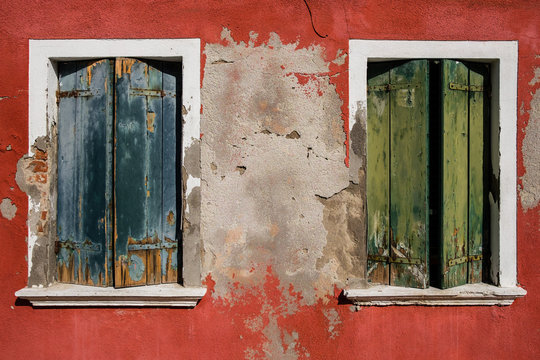 old houses with scraped walls or shoking colours, rusty doors or windows