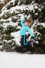 Winter sport, girl jumping in snow