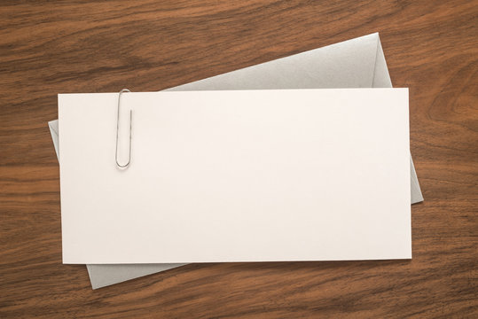 Envelope on wooden background  	
