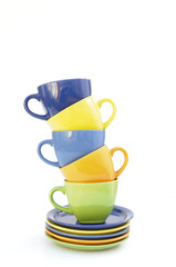 colored cups and plates