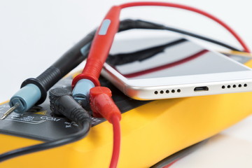 Yellow multimeter and the modern smartphone