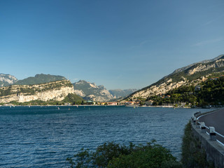 Naklejka na ściany i meble Beautiful peaceful lake Garda, Italy. Autumn, blue sky and bright sun.