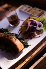 Fresh fish steak, serving with sides.