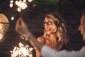 Blond woman laughing at party