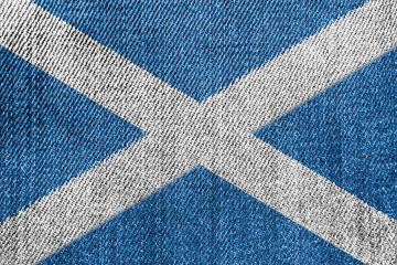 Fototapeta na wymiar Scotland Textile Industry Or Politics Concept: Scottish Flag Denim Jeans Background Texture