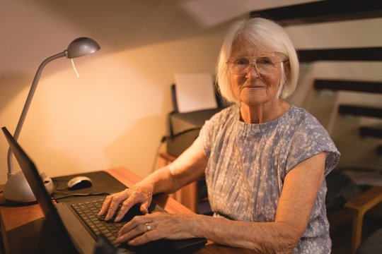 Senior Woman Working On Laptop