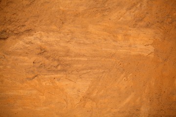 Brown clay mortar on a wall