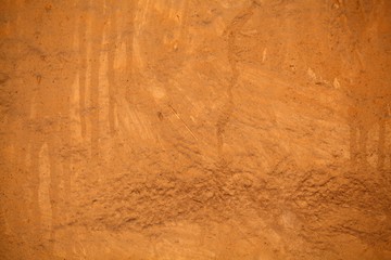 Brown clay mortar on a wall