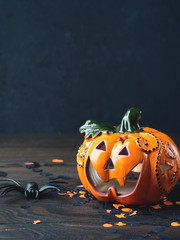 Halloween holiday symbols on dark wooden background
