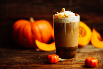 Pumpkin spice latte with whipped cream and caramel