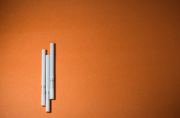 A top view image of several commercially made cigarettes.