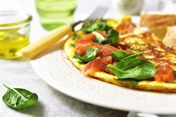 Omelette stuffed with spinach and salted salmon.