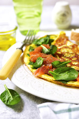 Omelette stuffed with spinach and salted salmon.