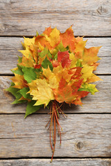 Autumn leafs on grey wooden table