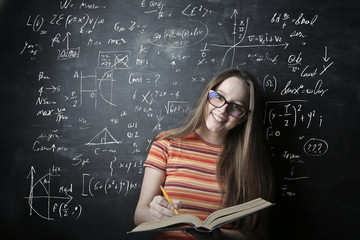 Smiling young woman studying at the university