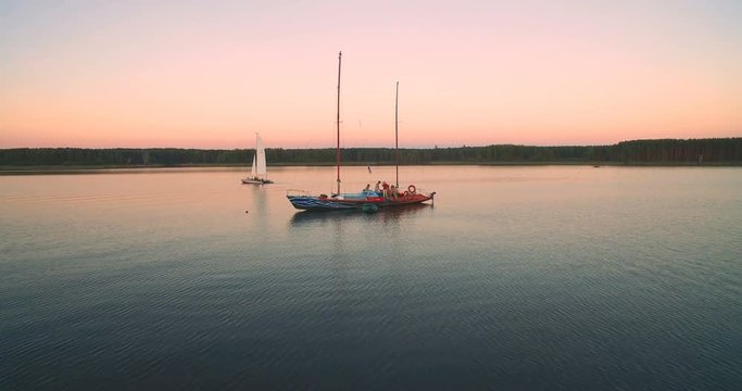 circular panorama of yacht in  bay at sunset aerial view. video editing