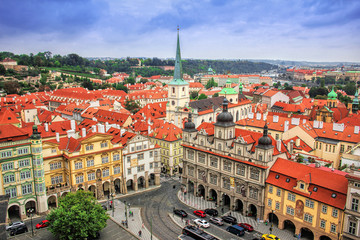 Amazing view of the roofs of buildings and Church of St. Thomas in Prague from the top of St...