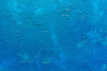 Texture of old peeled blue wall background