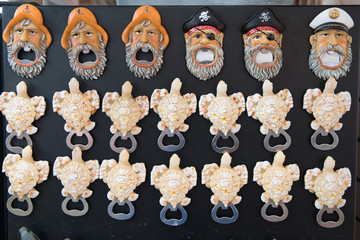 Bottle opener souvenirs on black background in Key West, USA