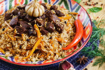 Pilaf with mutton, carrots, onions, garlic, pepper and cumin. A traditional dish of Asian cuisine.