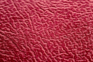 Texture of burgundy leatherette macro