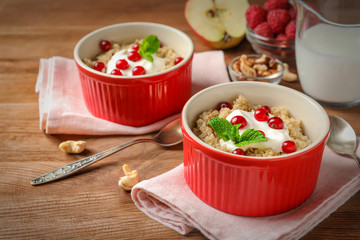 Ramekins with tasty quinoa on table