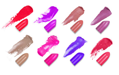 Set of colorful lipsticks smears with a slices of lipsticks isolated on a white background