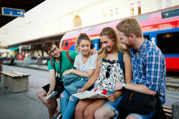 Young tourists travelling by train