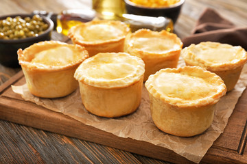 Delicious meat mini pies on board