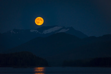 Fullmoon with mountain landscape