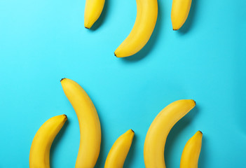 Yummy bananas on color background
