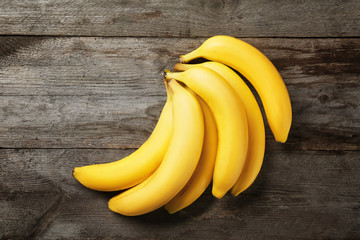 Yummy bananas on wooden background © Africa Studio