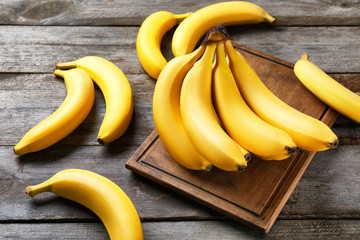 Yummy bananas on wooden background © Africa Studio
