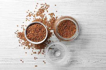 Brown lentils on wooden table