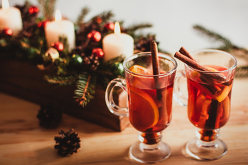 Beautiful Christmas background with mulled wine in a glass, gingerbread and New Year decor