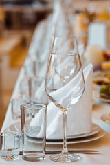 Served table with glasses and plates in the restaurant