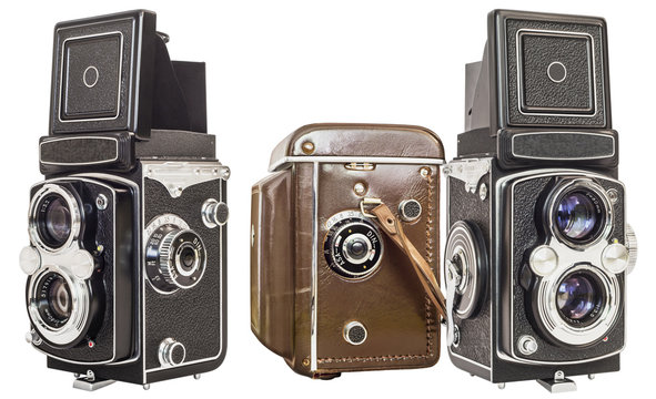 Three Same Make Old Twin Lens Reflex Cameras With One Packed In A Brown Leather Case Isolated On White Background