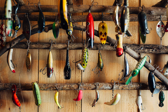 Various fishing tackles on a rack at a cabin