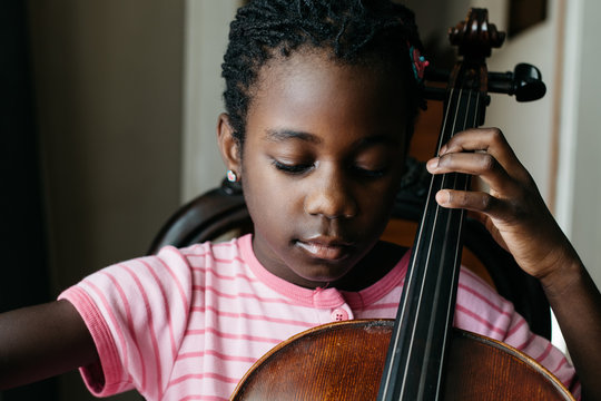Black girl with cello