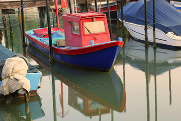 Fototapeta na wymiar small fishing boat moored in the marina