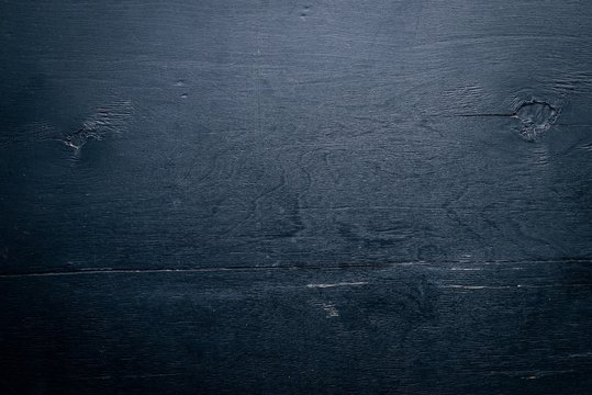 Black wooden background. Top view. Free space for text.