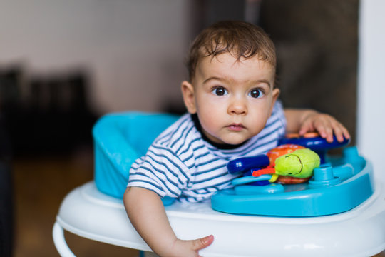 Baby Boy in a Walking Chair