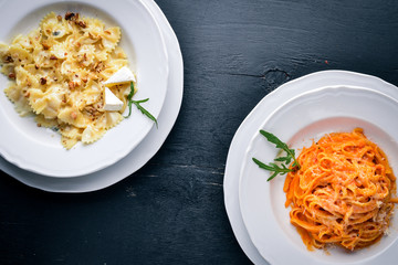 Pasta con pomidorro. On a wooden background. Top view. Free space for text.