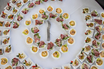 table full of  appetizer on a  wedding lunch