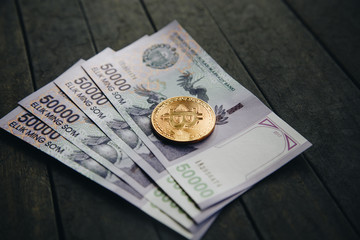 Uzbek banknotes and Bitcoin. Fifty Thousand Uzbek Sums